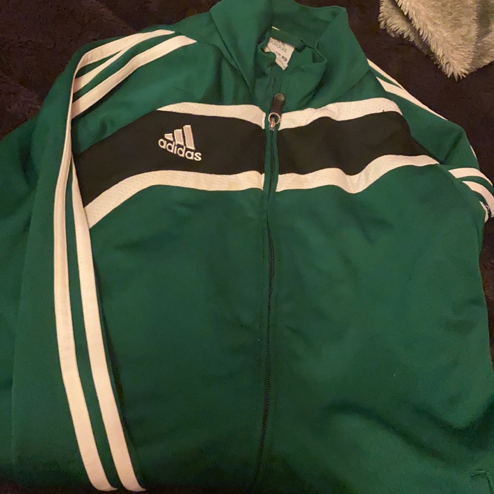 A green Adidas soccer hoodie